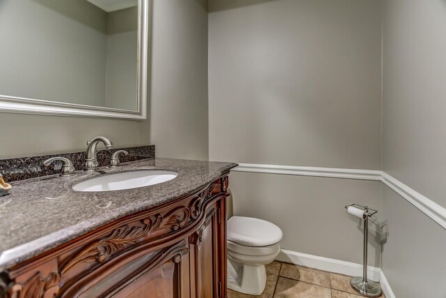 entryway with hardwood / wood-style floors, ornamental molding, and a textured ceiling