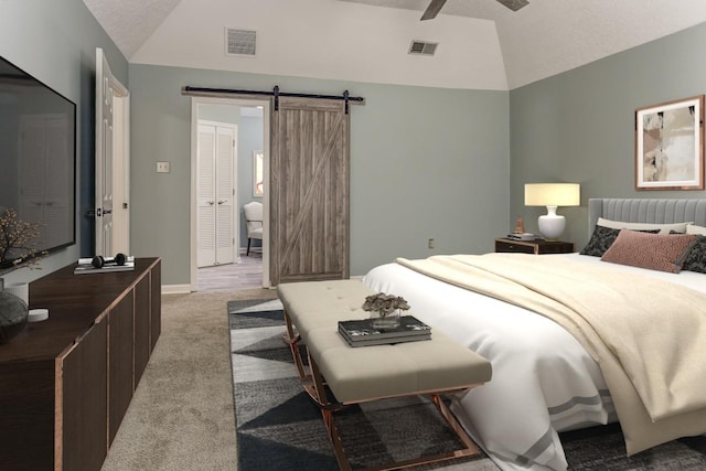 bedroom with carpet floors, visible vents, vaulted ceiling, and a barn door