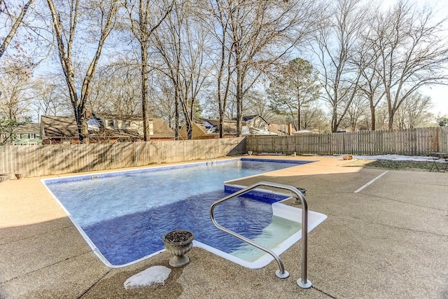 view of swimming pool featuring a patio area, a fenced backyard, and a fenced in pool