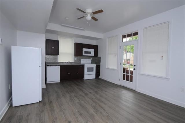 kitchen with ceiling fan, decorative backsplash, dark hardwood / wood-style floors, and white appliances