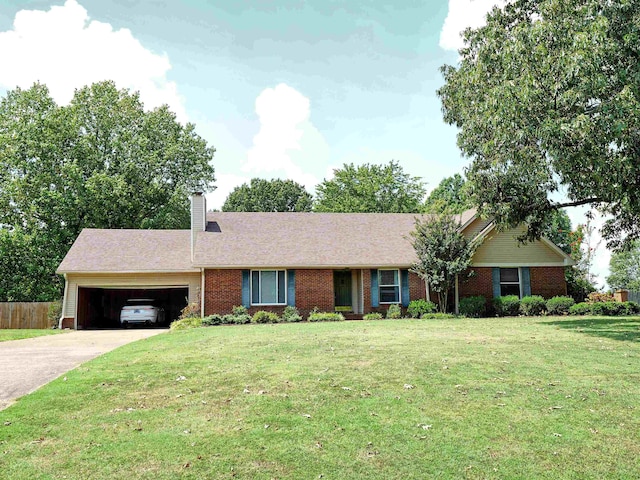 ranch-style house featuring a front yard and a garage