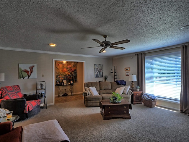 living room featuring ceiling fan, ornamental molding, a textured ceiling, and carpet floors