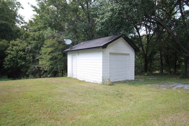 garage with a lawn