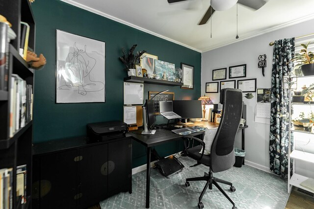 home office with crown molding and ceiling fan