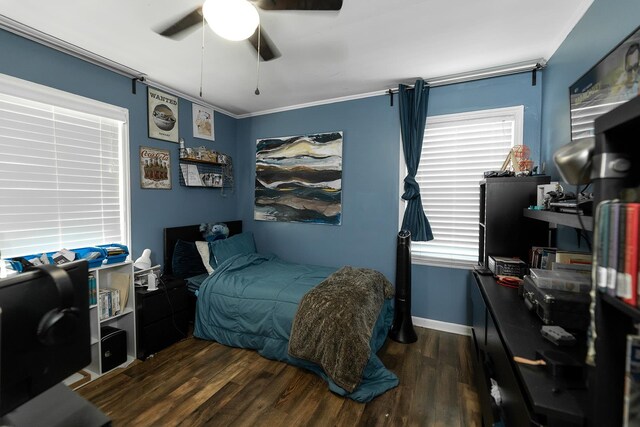 bedroom featuring ornamental molding, ceiling fan, and dark hardwood / wood-style floors