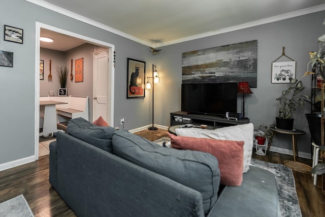 living room with dark wood-type flooring and ornamental molding