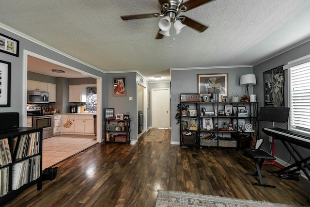 office area featuring ornamental molding, dark tile patterned flooring, and a textured ceiling