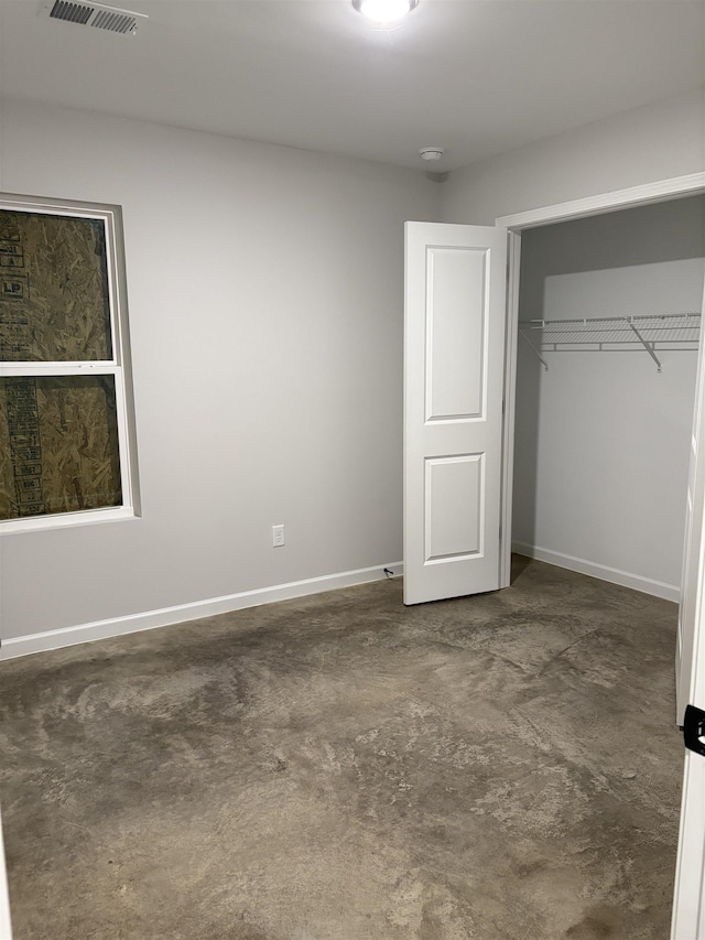 unfurnished bedroom with a closet