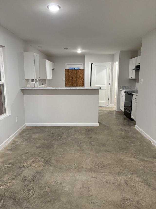 kitchen featuring black range with electric stovetop, kitchen peninsula, and white cabinets