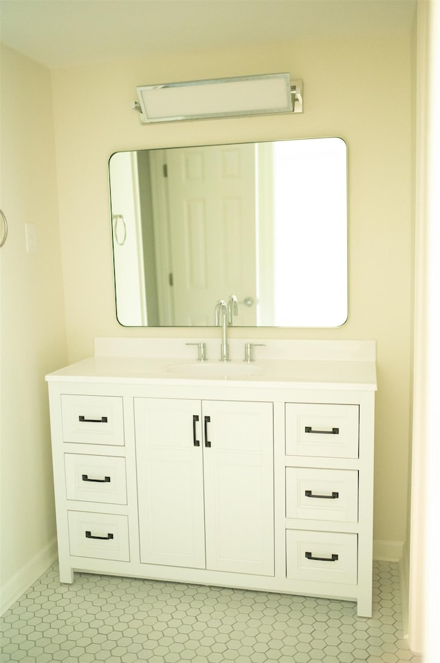 bathroom featuring baseboards and vanity