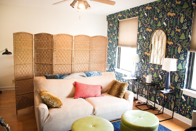 living room featuring ceiling fan, hardwood / wood-style floors, and a wealth of natural light