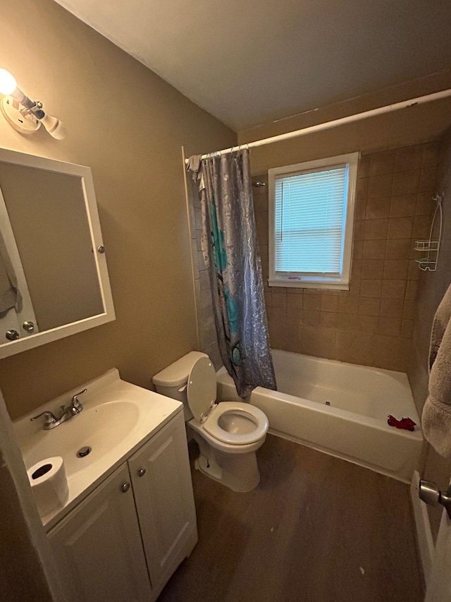 full bathroom with shower / tub combo, vanity, toilet, and wood-type flooring