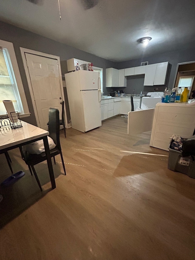 dining space featuring light wood-type flooring