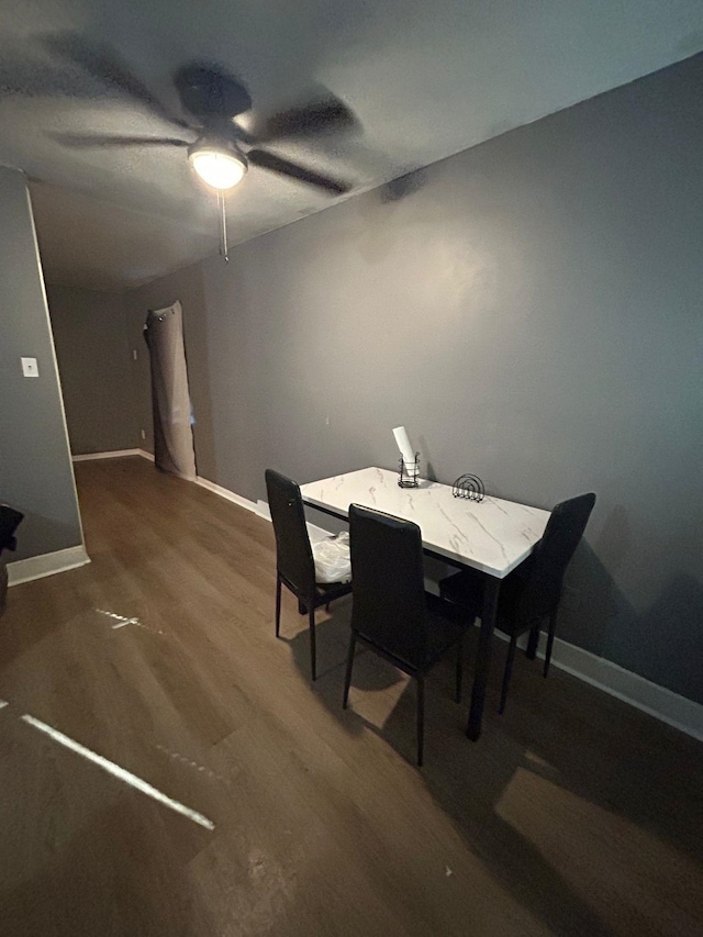 dining room featuring ceiling fan and hardwood / wood-style flooring