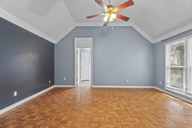 spare room featuring ceiling fan, baseboards, vaulted ceiling, and a textured ceiling