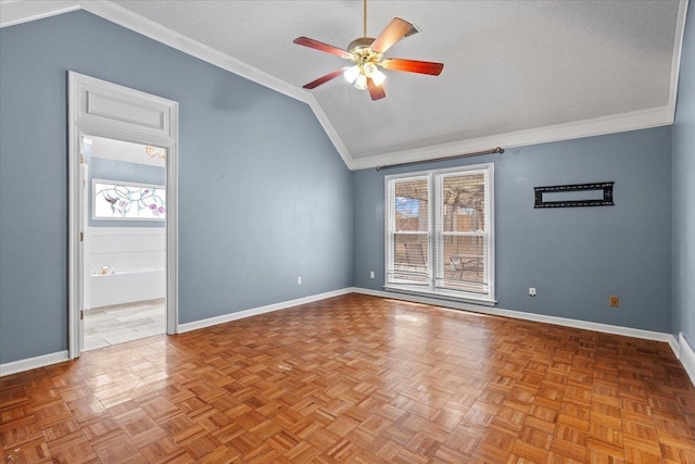 unfurnished room featuring ceiling fan, a textured ceiling, baseboards, vaulted ceiling, and crown molding