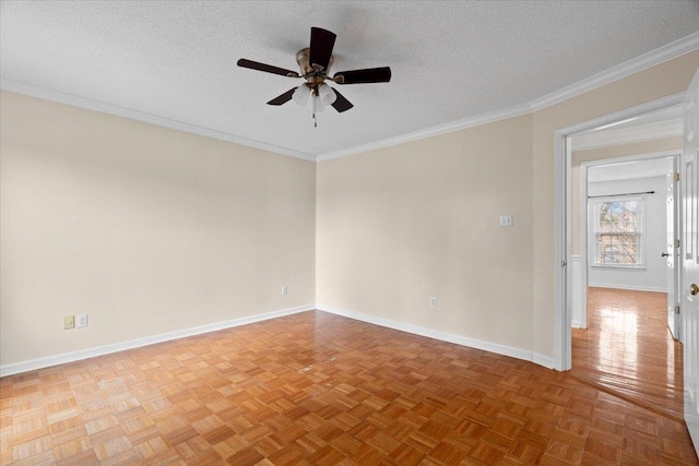 empty room with a textured ceiling, ceiling fan, baseboards, parquet floors, and ornamental molding