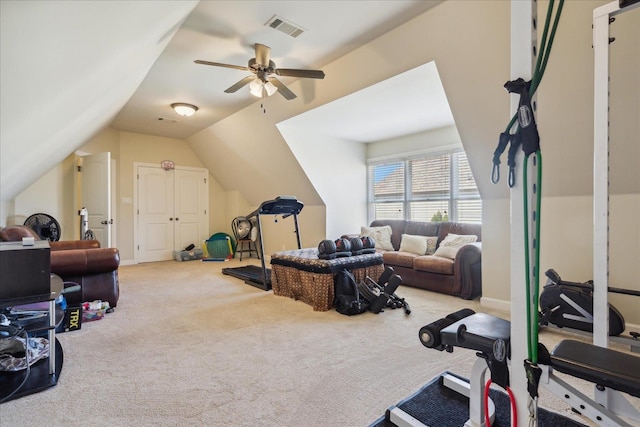 exercise room featuring ceiling fan, carpet flooring, and lofted ceiling