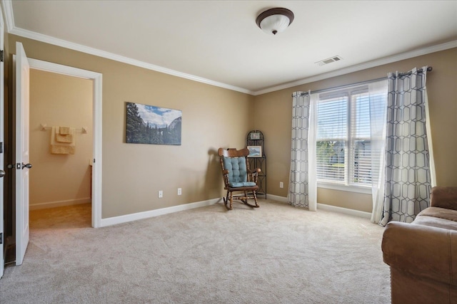 living area with crown molding and light colored carpet