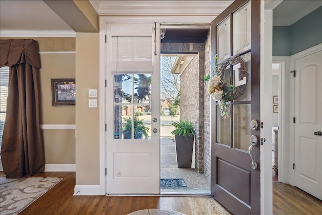 interior space featuring plenty of natural light, crown molding, and hardwood / wood-style floors