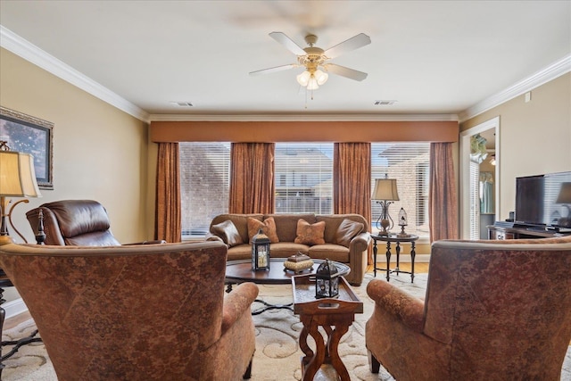 living room featuring ceiling fan and crown molding