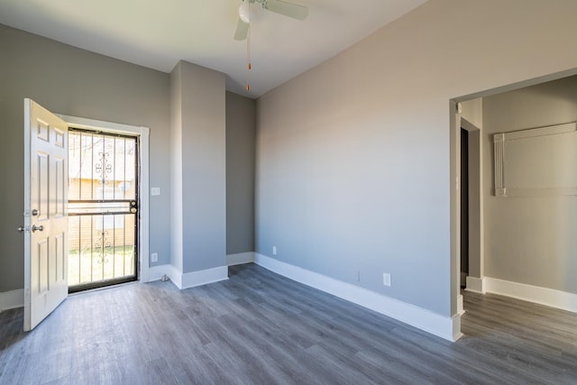 empty room featuring ceiling fan, wood-type flooring, and a healthy amount of sunlight