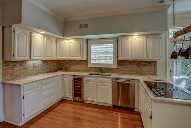 kitchen with visible vents, white cabinetry, light countertops, and dishwasher