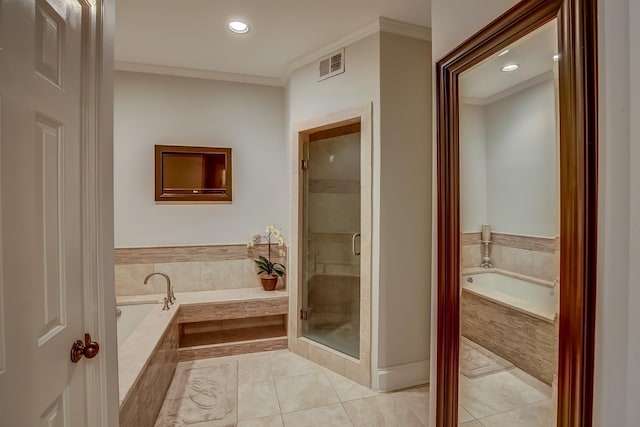 bathroom featuring a garden tub, tile patterned flooring, visible vents, and crown molding