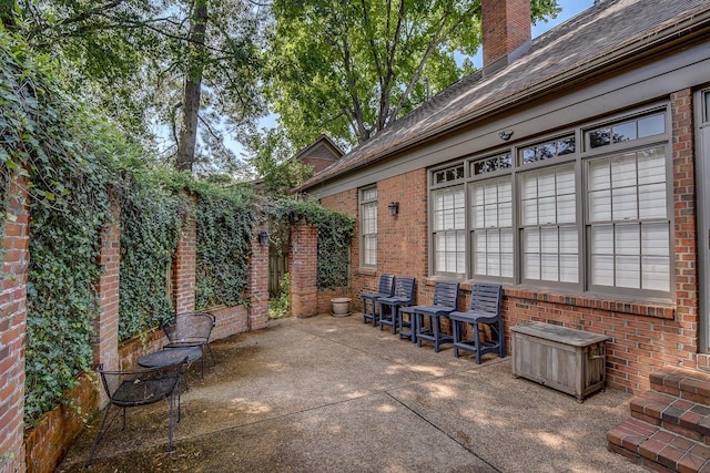 view of patio featuring fence