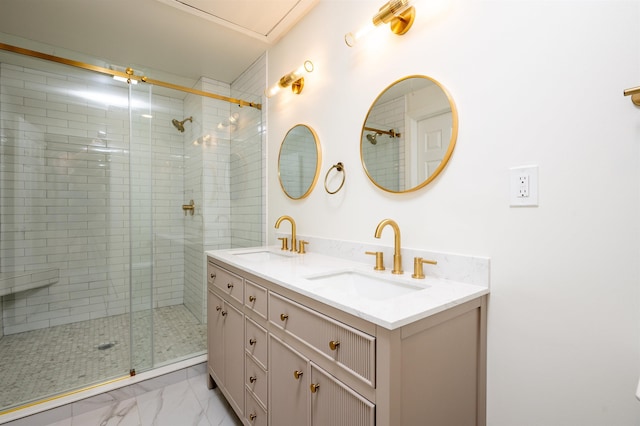 full bath featuring marble finish floor, double vanity, a sink, and a shower stall