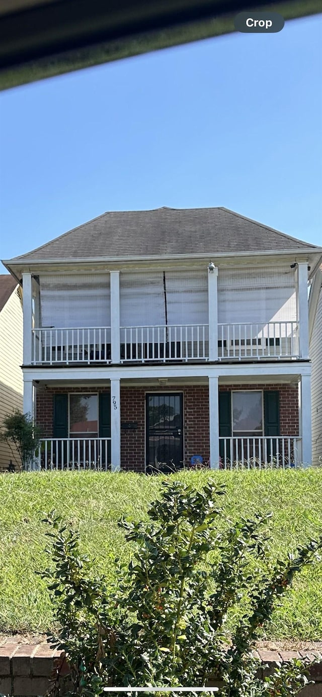 795 Williams Ave, Memphis, TN 38126 - view of home's exterior with brick siding, a balcony, and roof with shingles