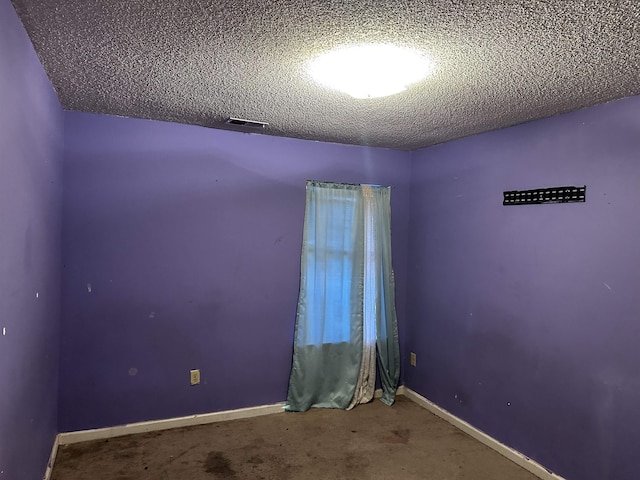795 Williams Ave, Memphis, TN 38126 - empty room with baseboards and a textured ceiling