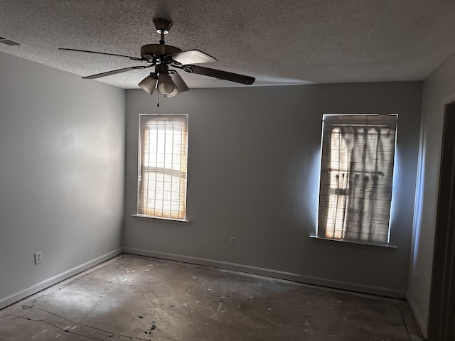 795 Williams Ave, Memphis, TN 38126 - spare room featuring baseboards, a textured ceiling, and a ceiling fan