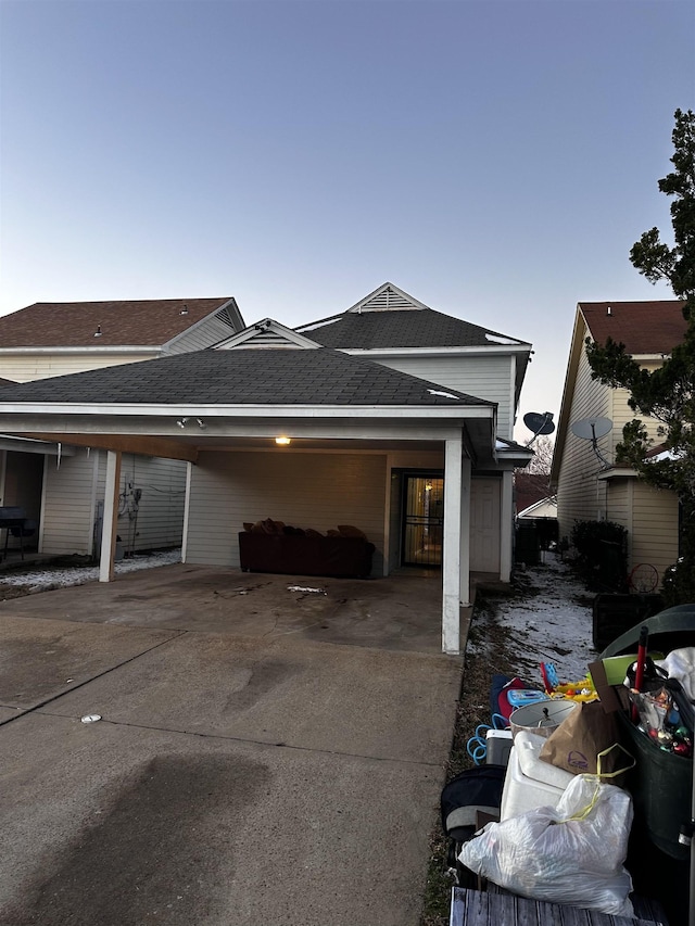 795 Williams Ave, Memphis, TN 38126 - view of home's exterior with concrete driveway, roof with shingles, and an attached carport