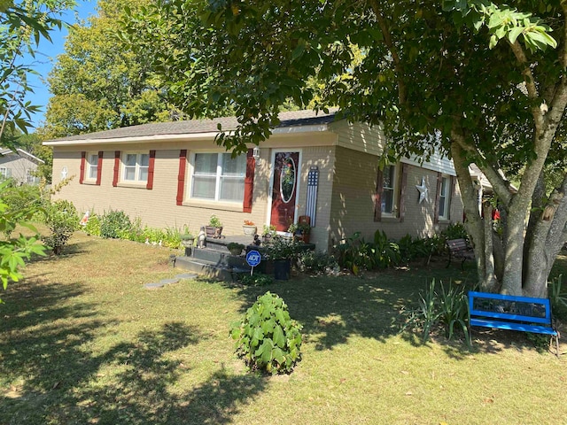 view of front of home with a front lawn