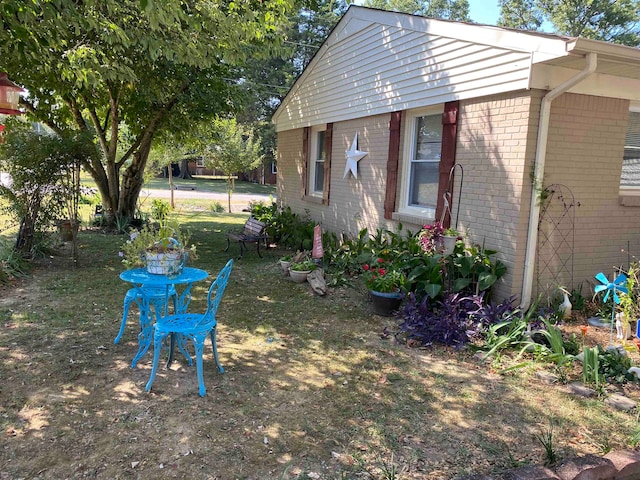 view of property exterior featuring a yard