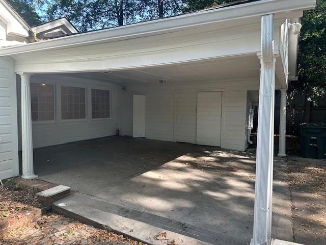 exterior space with a carport