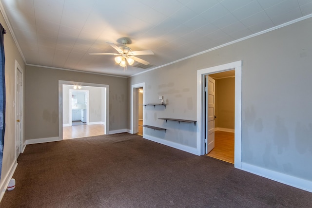 unfurnished living room featuring carpet flooring, crown molding, and ceiling fan