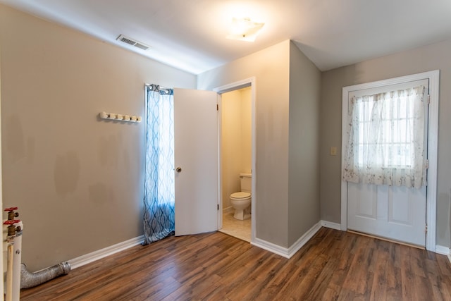 foyer with dark hardwood / wood-style floors