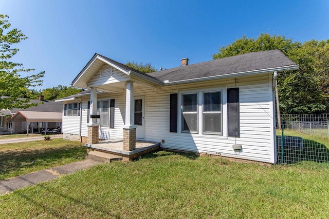 bungalow with a front lawn