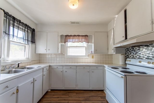 kitchen with white electric stove, dark hardwood / wood-style floors, white cabinetry, and sink