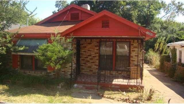 1584 Carpenter St, Memphis, TN 38108 - view of front of house featuring covered porch, a chimney, and brick siding