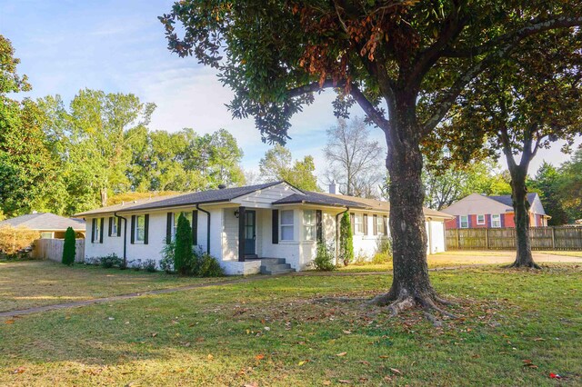 ranch-style house with a front lawn