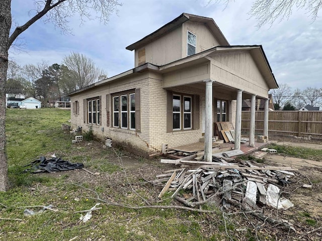 311 W Court Ave, Selmer, TN 38375 - view of side of home featuring brick siding and fence