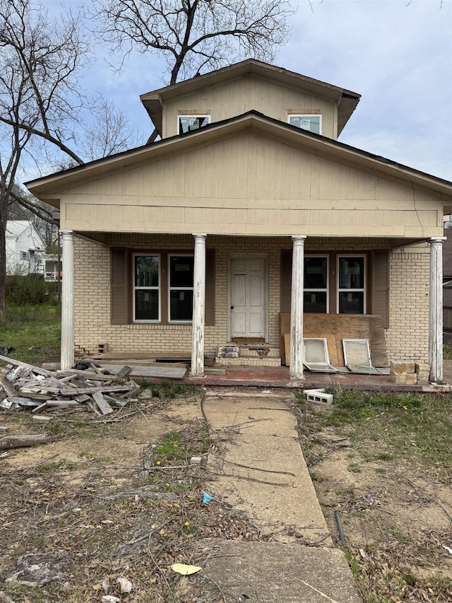 311 W Court Ave, Selmer, TN 38375 - view of front of house featuring a porch and brick siding