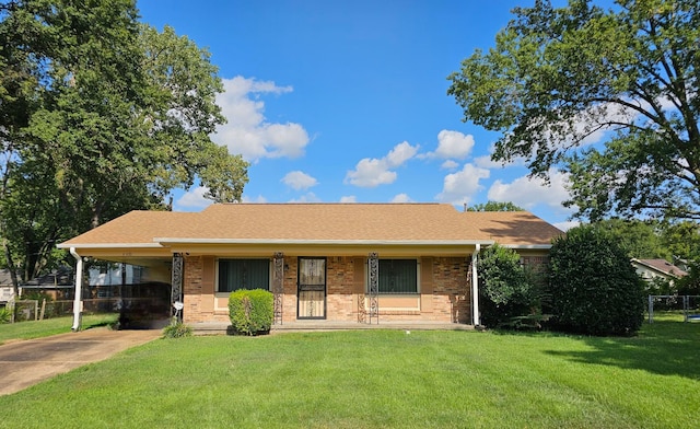 view of front of property with a front yard and a carport