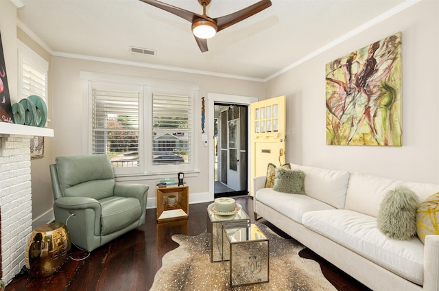 living area with a healthy amount of sunlight, visible vents, and crown molding