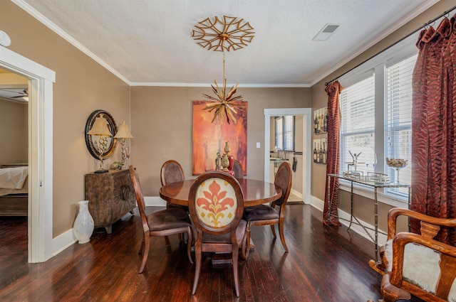 dining room with baseboards, dark wood-type flooring, a textured ceiling, and crown molding