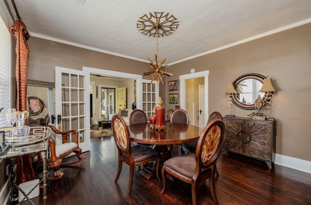 dining room with ornamental molding, french doors, baseboards, and wood finished floors