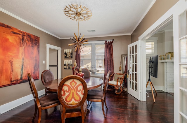 dining space featuring ornamental molding, a wealth of natural light, dark wood-style flooring, and visible vents